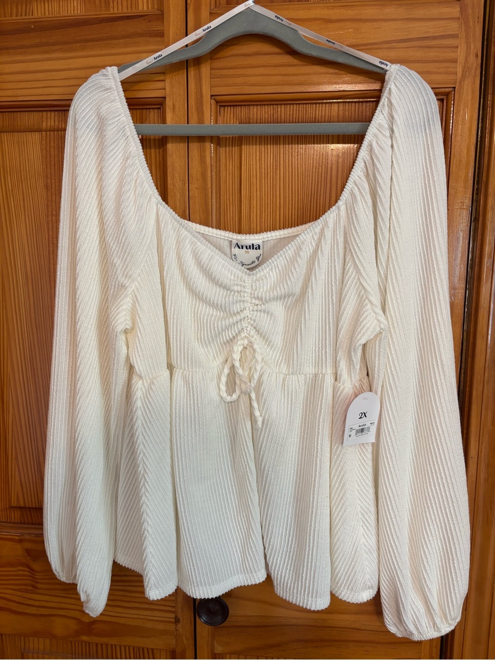 ARULA Cream Ribbed Long-Sleeve Peplum Top